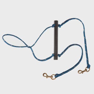 May include: A black metal horse lead with blue and white rope detailing. The lead features a central handle and two brass-colored snap hooks for attachment. The rope is braided with a blue and white pattern.