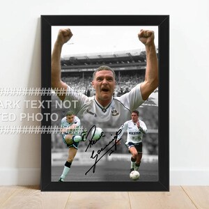 May include: Black framed print featuring a black and white image of a footballer celebrating with arms raised. Additional images of the player in action are included. The print is signed.