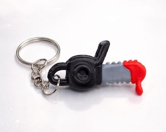 Llavero de motosierra sangrienta: amuleto de terror de Halloween impreso en 3D, accesorio espeluznante para bolso de asesino, regalo para fanáticos del terror.