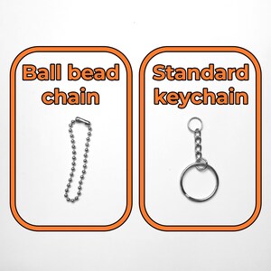 Side-by-side image comparison of two keychain types on a white background. The left side shows a silver ball bead chain with a clasp, labeled “Ball bead chain” in bold orange text. The right side shows a silver standard keychain with a jump ring and chain links, labeled “Standard keychain” in the same style.