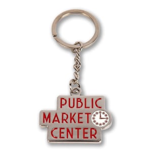 May include: Silver keychain with a red and white enamel sign that says "Public Market Center" with a clock face on the right side.