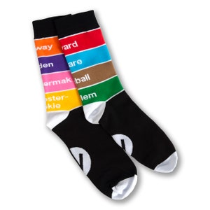 May include: A pair of black socks with colorful stripes and white text. The text on the socks reads "Subway, Garden, Square, Baseball, Oyster-okie, Salem".