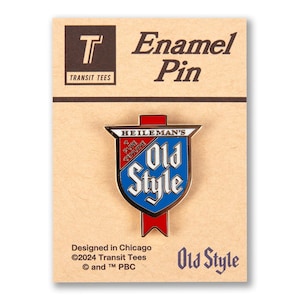 May include: An enamel pin featuring a red, white, and blue shield with the text "Heileman's Old Style" and "Pure Genuine" in a white banner. The pin is designed in Chicago and is a collectible for beer enthusiasts.
