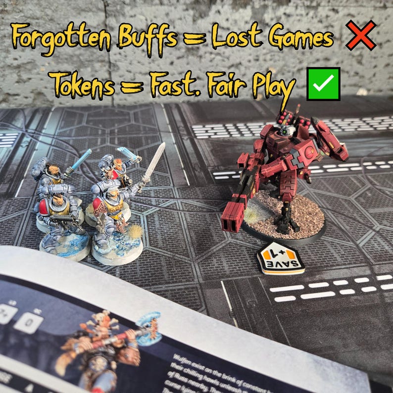 May include: Miniature tabletop game figures and tokens on a game board. The figures are painted in shades of red, gray, and yellow. Text on the board reads "Forgotten Buffs = Lost Games" and "Tokens = Fast. Fair Play."