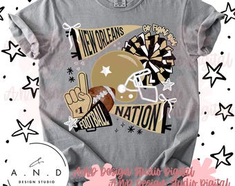 May include: A gray t-shirt featuring a football-themed graphic. The design includes a football helmet, a football, a pom-pom, and the words "New Orleans Nation" and "Go Fight Win". The shirt also has a finger pointing up with the number one.