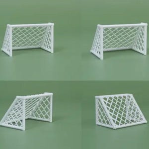 May include: Four white plastic miniature soccer goals. The goals are all the same size and shape, with a white net and white posts.
