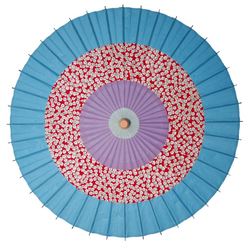Light blue and plum flower on red