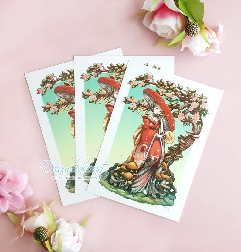 May include: Three prints of a woman in a red and white kimono standing under a mushroom tree with pink flowers. The woman is holding a fan and a small round object. The background is a light green and blue gradient.