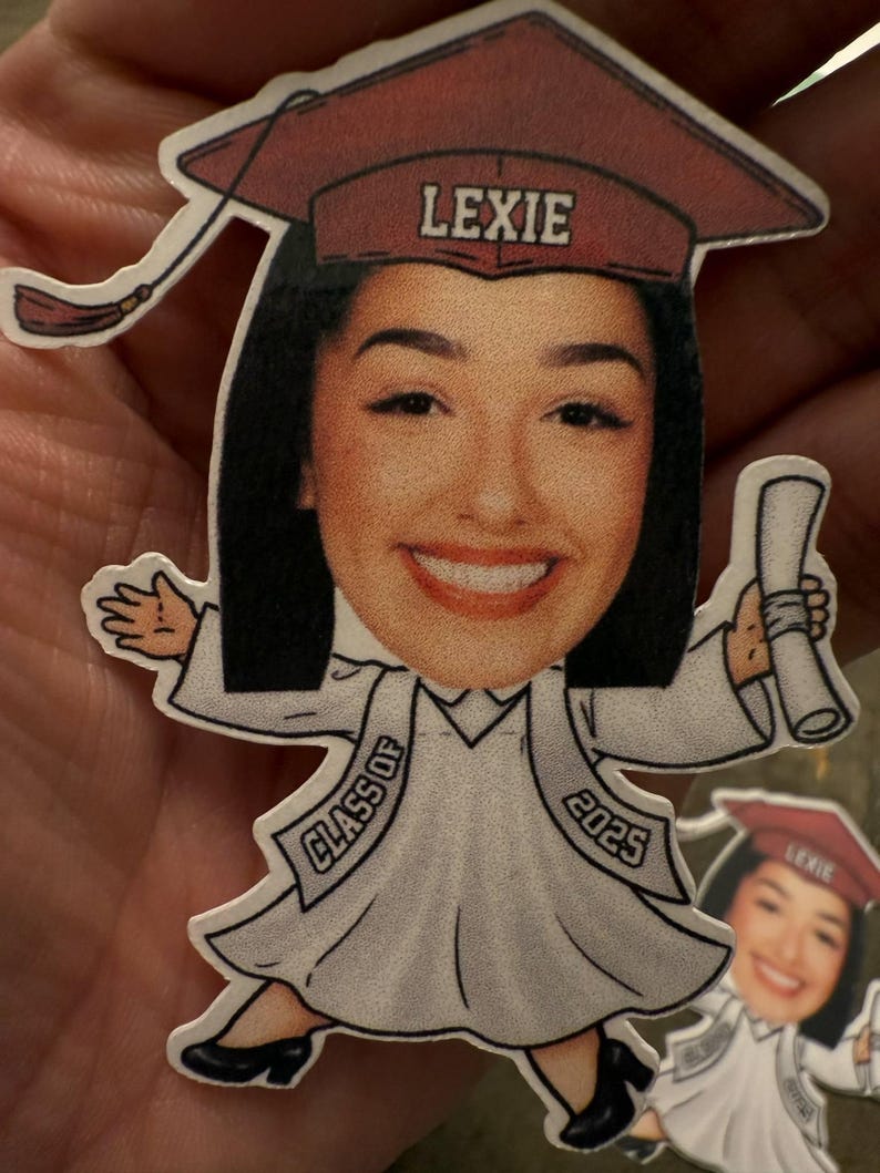 May include: A graduation cap with the name Lexie on it, a cartoon image of a person wearing a graduation gown and cap, holding a diploma, and the text "Class of 2025".