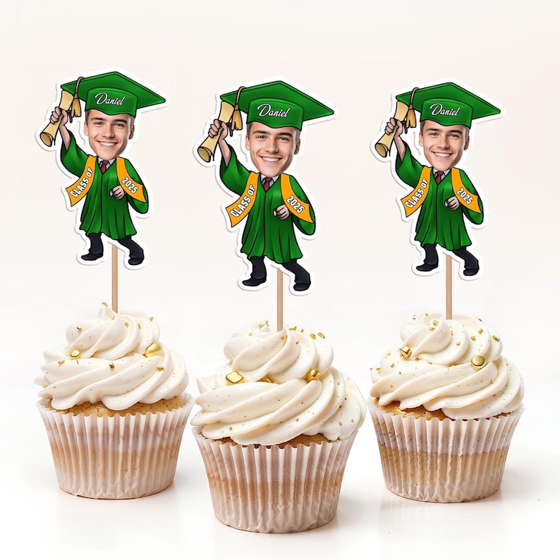 May include: Three graduation themed cupcake toppers with a cartoon image of a person wearing a graduation cap and gown. The toppers say "Daniel" and "Class of 2023".