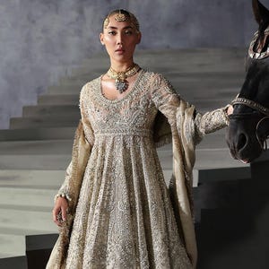 Golden Khaddi Net Pakistani Dress: Embroidered Party Gown