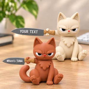 May include: Two cat figurines in a sitting pose, one cream-colored and one brown. Each cat holds a gray knife with a brown handle. The cream cat's knife displays the text YOUR TEXT, while the brown cat's knife displays the text Where's TUNA.