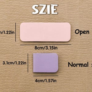 Puede incluir: Imagen que muestra la comparaci&oacute;n de tama&ntilde;o de dos formas rectangulares. La forma rosa, m&aacute;s grande, mide 8 cm de largo y la forma morada, m&aacute;s peque&ntilde;a, mide 4 cm de largo. El texto indica "Tama&ntilde;o abierto" y "Tama&ntilde;o normal". La palabra "TAMA&Ntilde;O" est&aacute; arriba.
