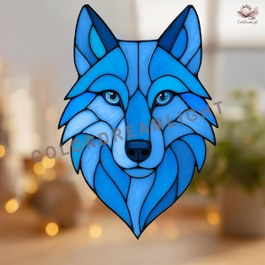May include: A stained glass wolf head in shades of blue, with a detailed design. The wolf's eyes are a lighter blue, and the image has the text "COLOR DREAM LIGHT".