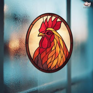 May include: Stained glass oval featuring a rooster. The rooster has a red comb and wattle, with yellow and orange feathers. The artwork is framed in a dark brown border and set against a light background.