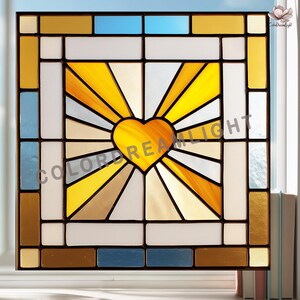 May include: Stained glass window panel with a heart-shaped sunburst design. The panel uses yellow, gold, white, blue, and brown in a geometric pattern. The text "COLOREDREAMLIGHT" is visible. A decorative piece for a window, it adds a touch of color.