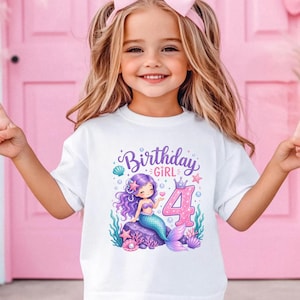 May include: White t-shirt with a colorful mermaid graphic and the text "Birthday Girl 4". The illustration features a purple-haired mermaid, a pink number 4, and aquatic elements. The shirt is designed for a child's birthday celebration.