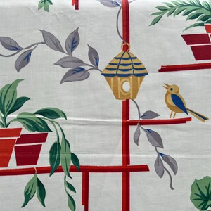 May include: White fabric with a repeating pattern of potted plants, a birdhouse, and a bird. The plants are in red pots with green leaves. The birdhouse is yellow with blue accents, and the bird is yellow and blue. Red lines create shelves.