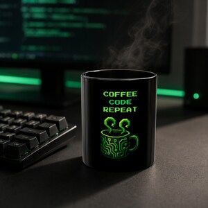 May include: A black ceramic mug featuring a green pixel art graphic of a coffee cup with circuit board patterns and steam rising from the top. The text COFFEE CODE REPEAT is printed in green pixelated font above the cup illustration.