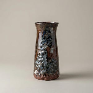 Textured Ceramic Vase with Rock-Like Surface and Dark Gloss Glaze