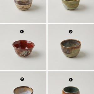 May include: A collection of six small, handcrafted ceramic bowls. Each bowl features unique color variations, including blue, green, brown, and red hues. The bowls have a rustic, textured appearance, suggesting a handmade quality.