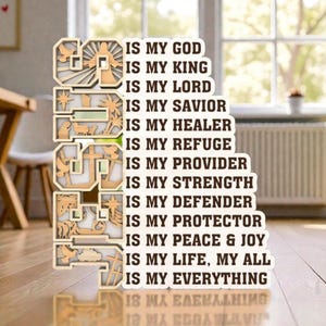 May include: A wooden sign with the words "IS MY GOD" and other phrases of faith. The sign is in a layered design with cut-out images of crosses, doves, and other religious symbols. The sign is on a wooden floor.
