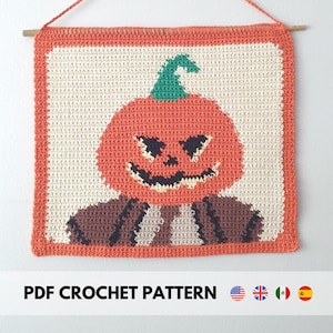 May include: Crochet pattern for a pumpkin with a spooky face. The pattern is available in English, Spanish, French, Italian, and German. The pattern is for a wall hanging.