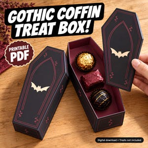 May include: A black coffin-shaped treat box with red vine accents and a gold bat graphic. The box is a printable PDF, featuring a removable lid and a deep red interior containing three assorted chocolates. Text reads GOTHIC COFFIN TREAT BOX! and PRINTABLE PDF.