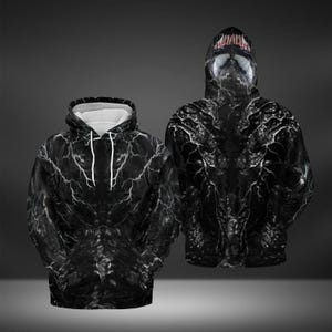 May include: Two black hoodies with a white interior hood and drawstring. The hoodies feature a detailed, all-over print of a white lightning-like pattern on a black background. One hoodie has a hood with a mask design.