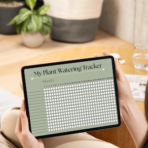 Könnte beinhalten: Ein digitales Tablet zeigt einen Pflanzen-Gieß-Tracker mit grünem Hintergrund und einem weißen Raster an. Der Tracker hat eine Kopfzeile mit der Aufschrift "My Plant Watering Tracker" und einen Abschnitt für den Monat mit den Zahlen 1 bis 30.