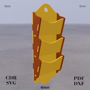 May include: A two-tone wall organiser with three pockets. The pockets are yellow, and the sides are brown. It has a decorative top with a hole for hanging. Dimensions are 3mm, 4mm, and 5mm.