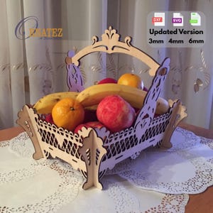 May include: A wooden fruit basket with a handle, filled with bananas, oranges, and red apples. The basket has a decorative, openwork design. Text on the image reads "Updated Version 3mm 4mm 6mm".