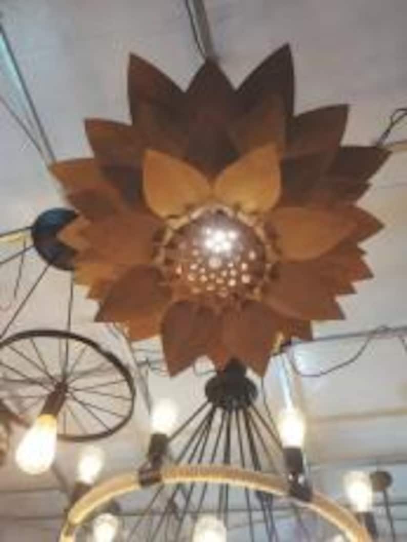 Hanging ceiling light with flower-style laser-cut shade casting decorative shadows, designed for 3mm–5mm plywood or MDF