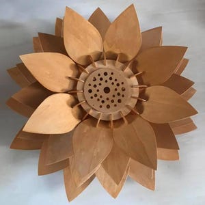 Laser-cut wooden lampshade with downward-curved petals and open center, perfect for pendant lighting or ceiling fixtures