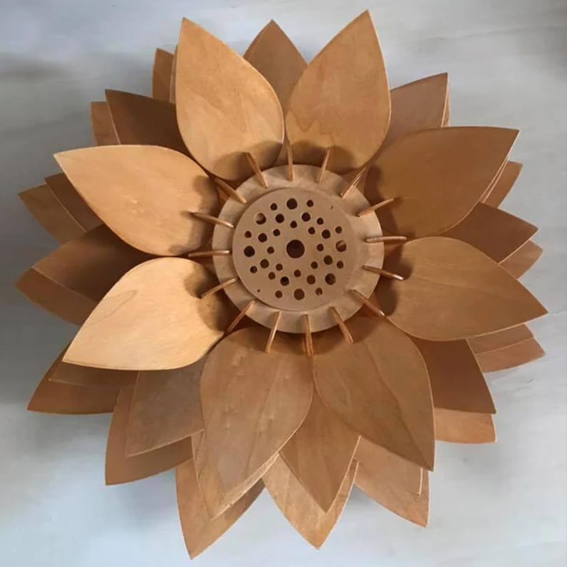 Laser-cut wooden lampshade with downward-curved petals and open center, perfect for pendant lighting or ceiling fixtures