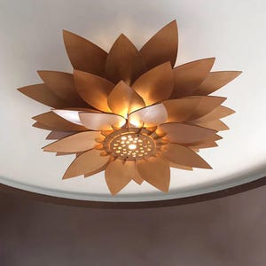 Black wood pendant light fixture created from SVG DXF CDR laser cut files, displayed in a minimalist modern home interior