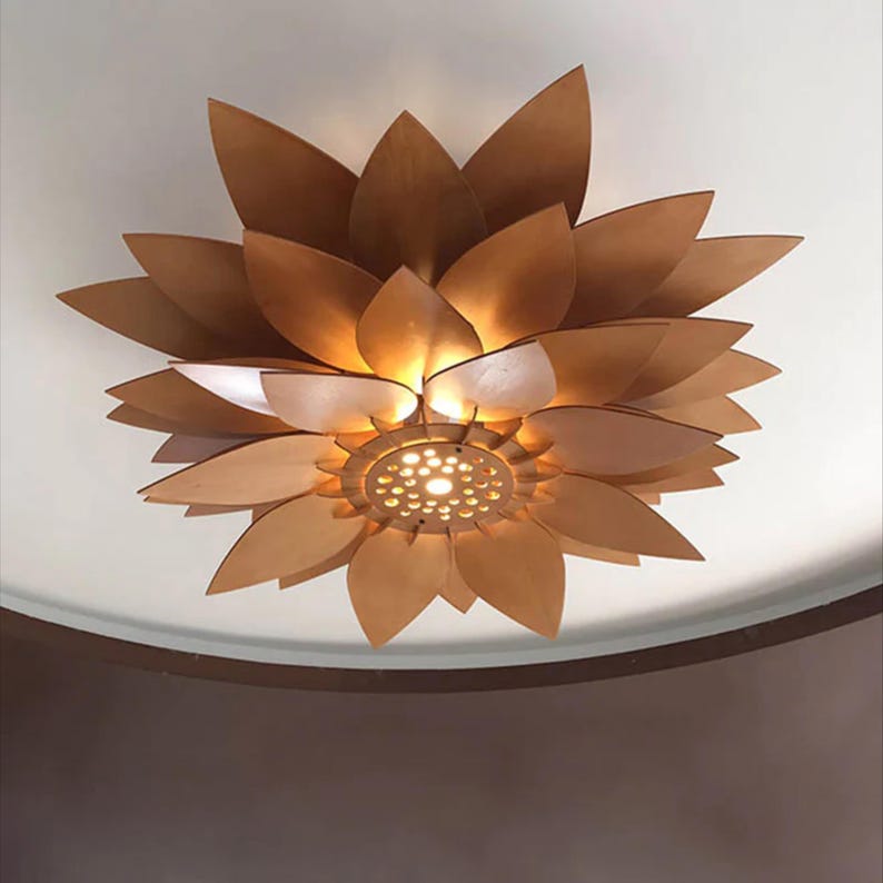 Black wood pendant light fixture created from SVG DXF CDR laser cut files, displayed in a minimalist modern home interior