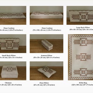 May include: A collection of beige and brown decorative pillows, cushions, an ottoman, and a rug. The items feature a geometric pattern in brown. The floor cushion is 75 inches long, and the rug is 47 x 71 inches.