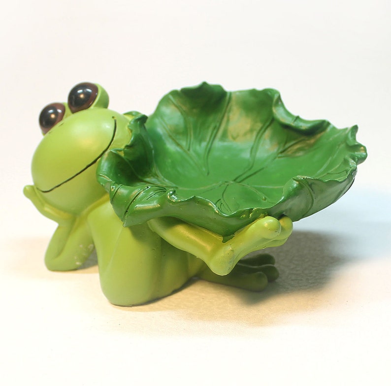 reclining frog statue