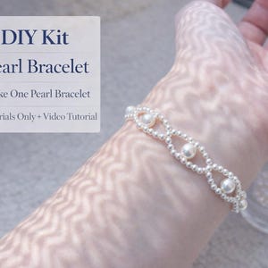 May include: A DIY kit for a pearl bracelet. The bracelet is made of small, silver-colored beads and larger, round pearls. The text on the image reads: DIY Kit Pearl Bracelet, Make One Pearl Bracelet, Materials Only + Video Tutorial.