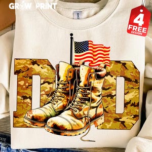 May include: Cream-colored sweatshirt with a camouflage "DAD" design. The design features a pair of tan combat boots, an American flag, and the text "4 FREE DESIGN" on a red tag.