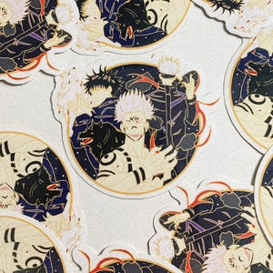 May include: A collection of anime-style stickers featuring characters with white and black hair, set against a dark blue and gold background. The stickers have a circular design with intricate details and a white border.