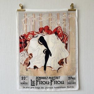 May include: A rectangular wall hanging featuring a vintage-style illustration of a person in a white garment with black stockings. The print includes the text "LE FROU-FROU", "20 CENTIMES", and "20 PAGES", suspended by two gold-toned metal clips.