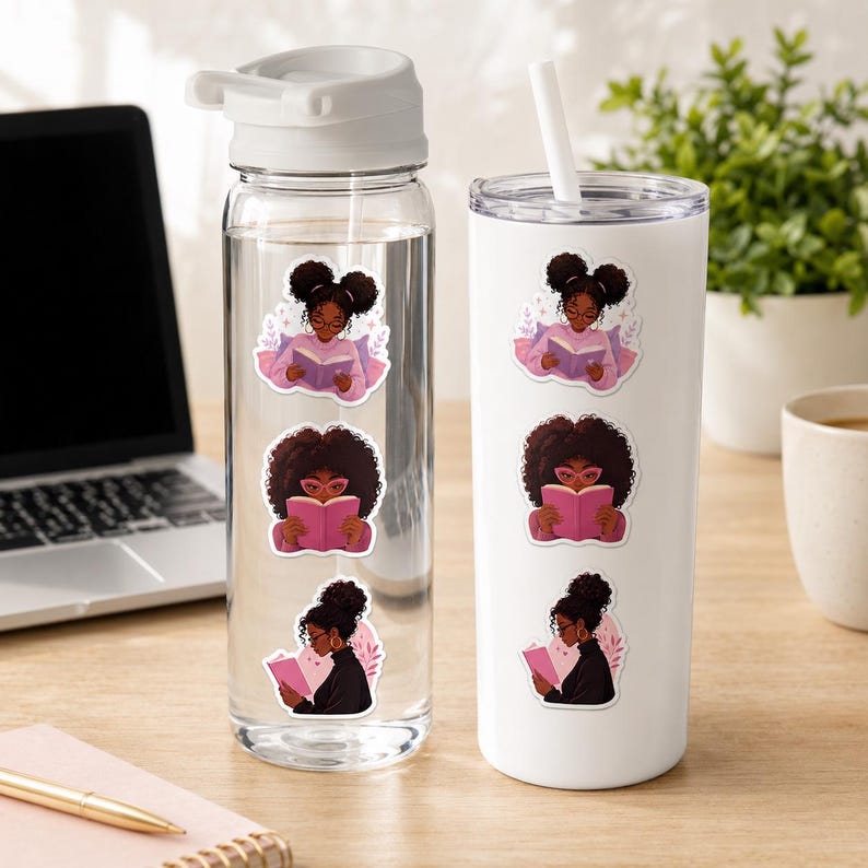 a clear water bottle and a white tumbler with stickers on them, placed on a wooden desk next to a laptop and a plant.