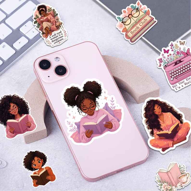 a pink smartphone with a sticker of a young girl reading a book, surrounded by various other stickers and illustrations.