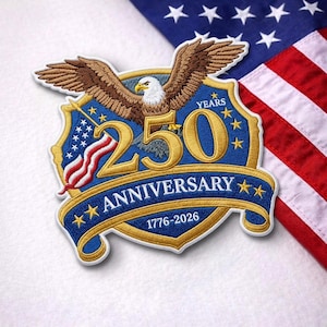 May include: Embroidered patch featuring a soaring eagle, the number "250", and the text "Anniversary 1776-2026". The patch is in blue, gold, brown, red, and white, with the American flag in the background.