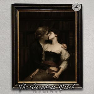 May include: Framed fine art print of a romantic scene. Two figures are embracing and kissing, set against a backdrop of a library. The print is in a black frame, with the text "The Decadent Witch Fine Art Prints" at the bottom.