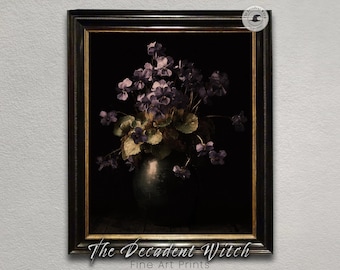 May include: A framed art print featuring a still life of purple flowers in a dark vase. The artwork is set against a black background, with the text "The Decadent Witch Fine Art Prints" at the bottom.