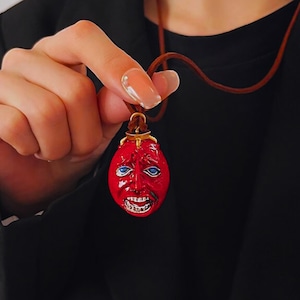 Behelit Griffith Egg of King Necklace – Berserk Anime Pendant – Red Resin Horror Face Pendant – Gothic Leather Cord Necklace – Cosplay Gift