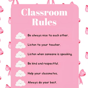 Op de afbeelding: Een roze poster met de woorden "Klassenregels" in het wit. De regels staan onder de titel, waaronder "Wees altijd aardig voor elkaar" en "Doe altijd je best". Roze strikken zijn verspreid over de poster.